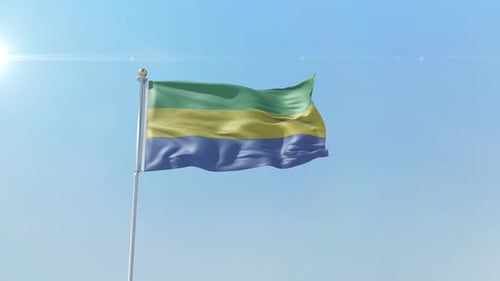 Gabon National Flag Waving in Clear Blue Sky