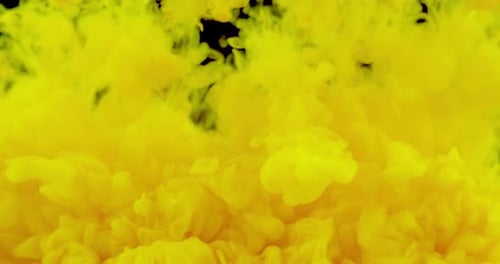 Bright Yellow Liquid Plume on Black Background