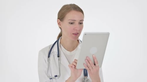 Young Woman Doctor Uses Tablet Device