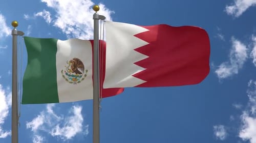 Mexican and Bahrain Flags Waving in the Wind