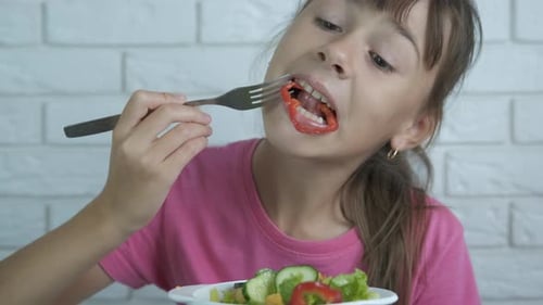 Girl Eating Salad for Health and Nutrition