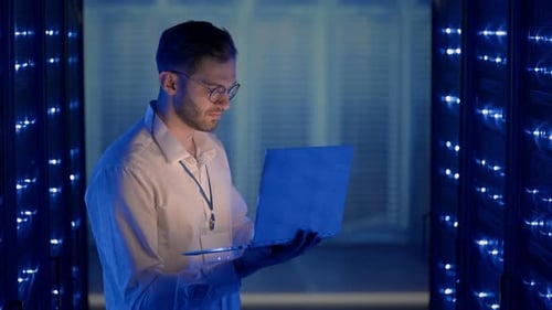 Data Center IT Specialists Coworking in Secure Server Room of Cyberspace