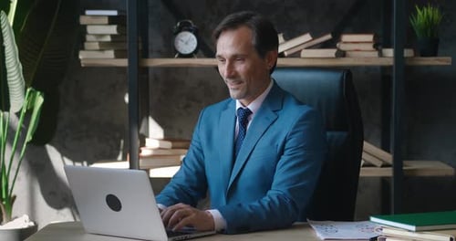 Mature Businessman Adult Employer Working at Laptop Computer in Office Room