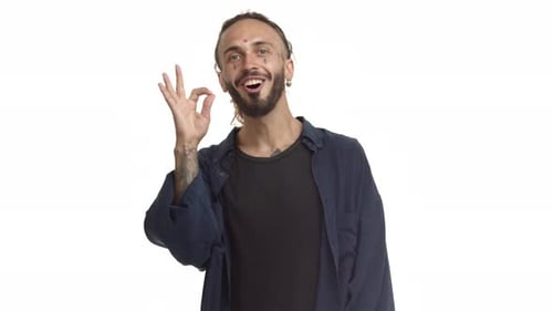 Smiling Man Gives Ok Hand Gesture