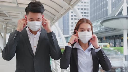 Asian Group of young office business people remove face mask in city with new normal lifestyle.