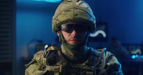 Soldier in Military Gear Looking at Camera Close Up