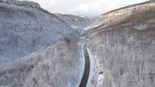 Aerial View of Plateau LagoNaki Mountain Twisted Road in the Winter and Driving Car