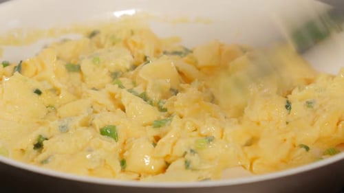 Cooking Scrambled Eggs with Green Onions in Pan