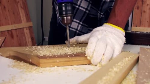 Carpenter Working on Wood Craft at Workshop