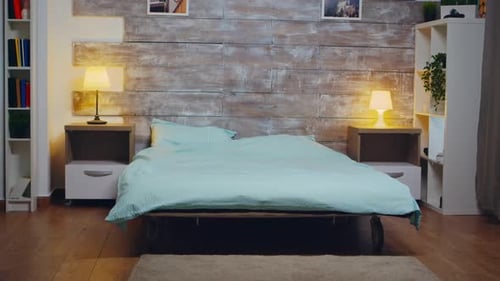 Modern Bedroom with Turquoise Bed and Wood Wall