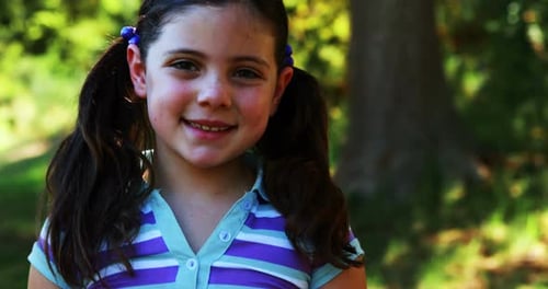 Portrait of a girl standing in the park