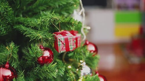 Decorated Christmas Tree with Red Ornaments and Lights