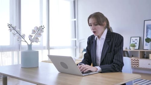 Shocked Woman Reacts to Computer News