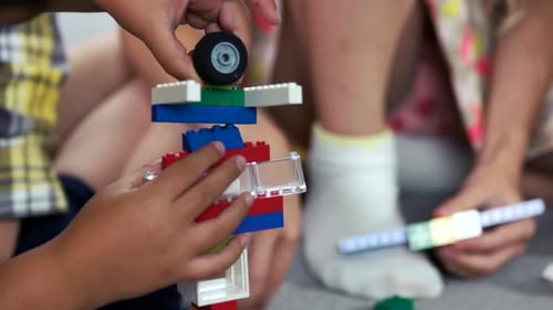 Close Up Child Building Figure with Block Toys
