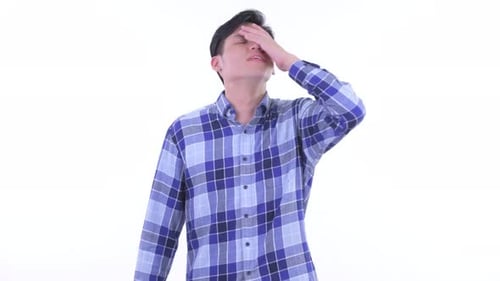 Young Adult Expressing Disapproval Thumbs Down Hand Gesture
