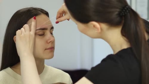 Eyebrow Threading for Hair Removal Beauty Treatment