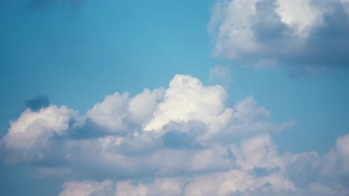 Clouds Drifting Slowly Across the Blue Sky