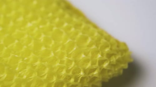 Close-Up of Bright Yellow Textured Fabric Pattern