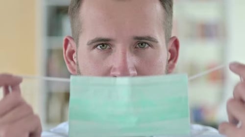 Close Up of Young Man Wearing Face Mask