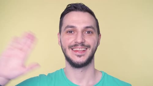 Smiling Man Waving Hello Close Up Portrait