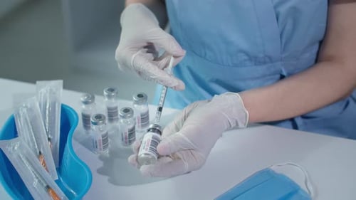 Medical Professional Draws COVID-19 Vaccine Into Syringe