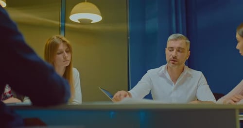 Freelancers at a Meeting in a Modern Coworking Office Discussing Business Plans