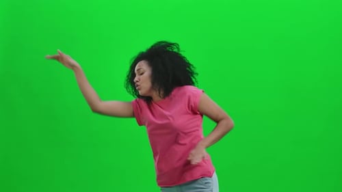 Energetic Woman Dancing on Green Screen Background