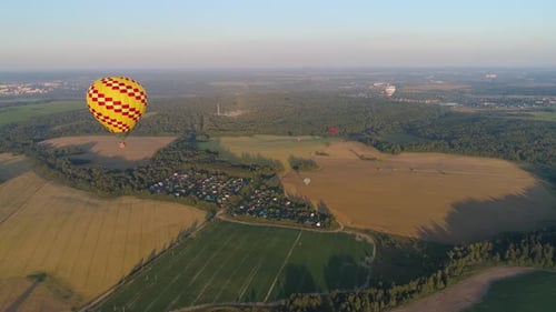 Scenic Rural Landscape with Hot Air Balloons