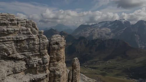 Steep mountain cliff, amazing Dolomites landscape, highland valley aerial view