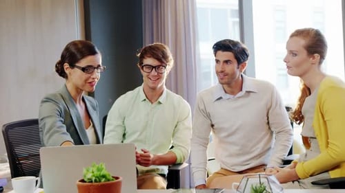 Enthusiastic Team Collaborating in a Modern Office