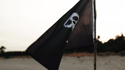 Pirate Flag Waving on Beach Close Up