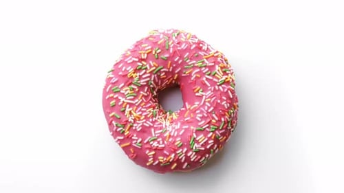 Beautiful Delightful Sweet Donut Slowly Rotating Isolated on White