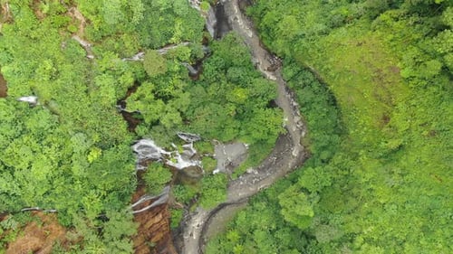 Flying Over the Mountain River in Tropical Forest