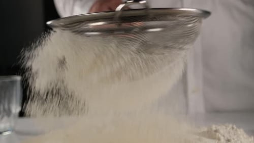 Chef Sifting Flour