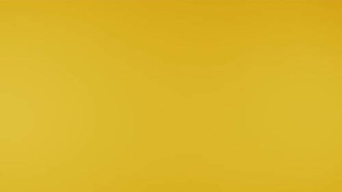 Chocolate Cereal Pieces Falling on Yellow Background