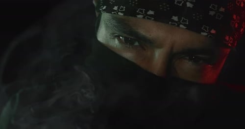 Mysterious Figure Obscured by Bandana and Smoke