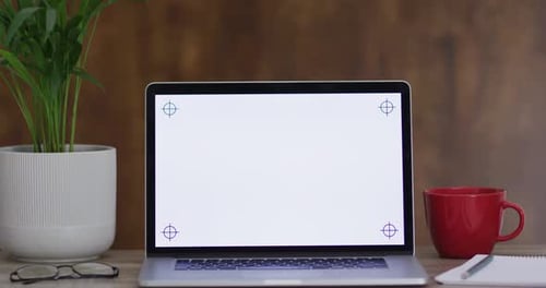 Video of laptop on wooden table with copy space in office