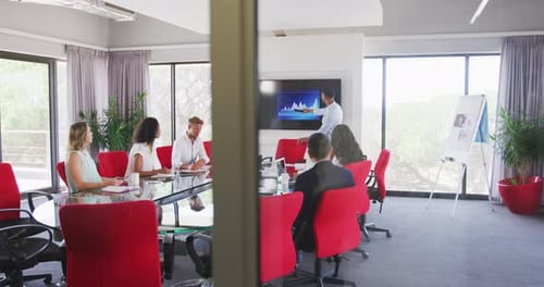 Professional businessman giving presentation in meeting room in modern office in slow motion