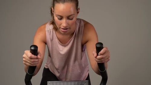 Woman Working Out on Elliptical Machine