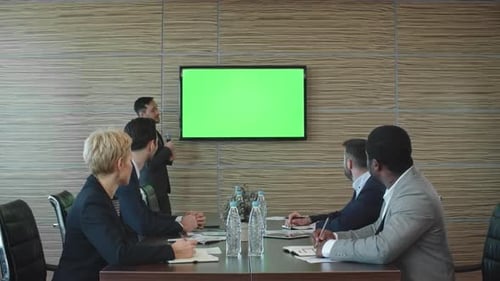 Business Presentation with Green Screen in Modern Office