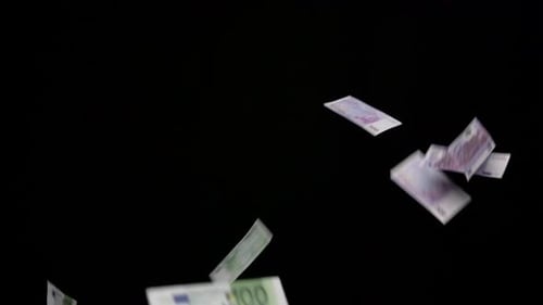 Euro Bills Falling on Black Background