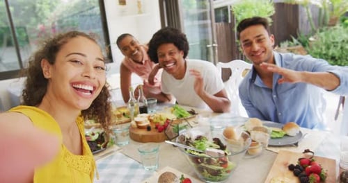 Group of Young Adults Smiling and Waving