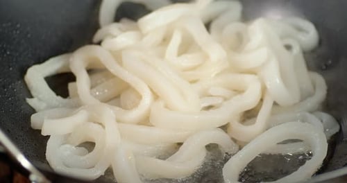 Boiling White Squid Rings in Steel Pan