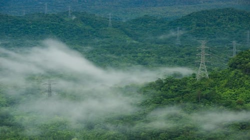 Aerial view high voltage power transmission towers.