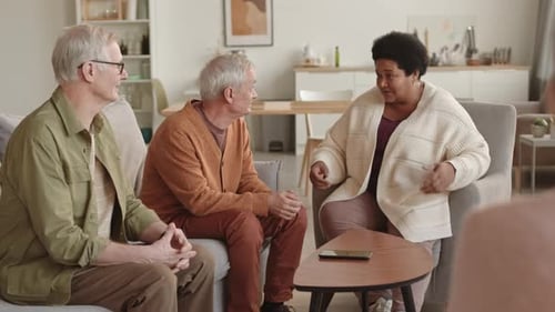 Three Senior Adults Having a Conversation at Home