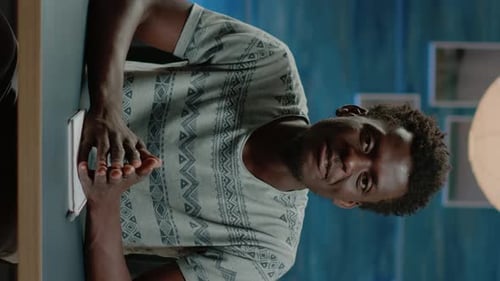 Young Adult Man Talking Indoors, Vertical Video