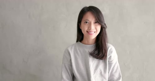 Woman Smiling at Camera in Home Interior