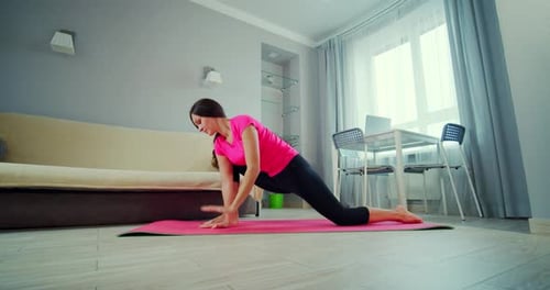Woman Doing Yoga Stretch at Home