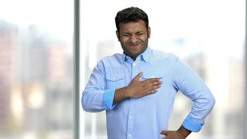 Young Indian Man Having Chest Pain