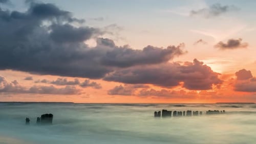 Golden sunset with dramatic cloudscape over the sea